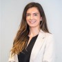 Rebecca Harrop, Associate Director at Brand Finance seen in a formal office outfit
